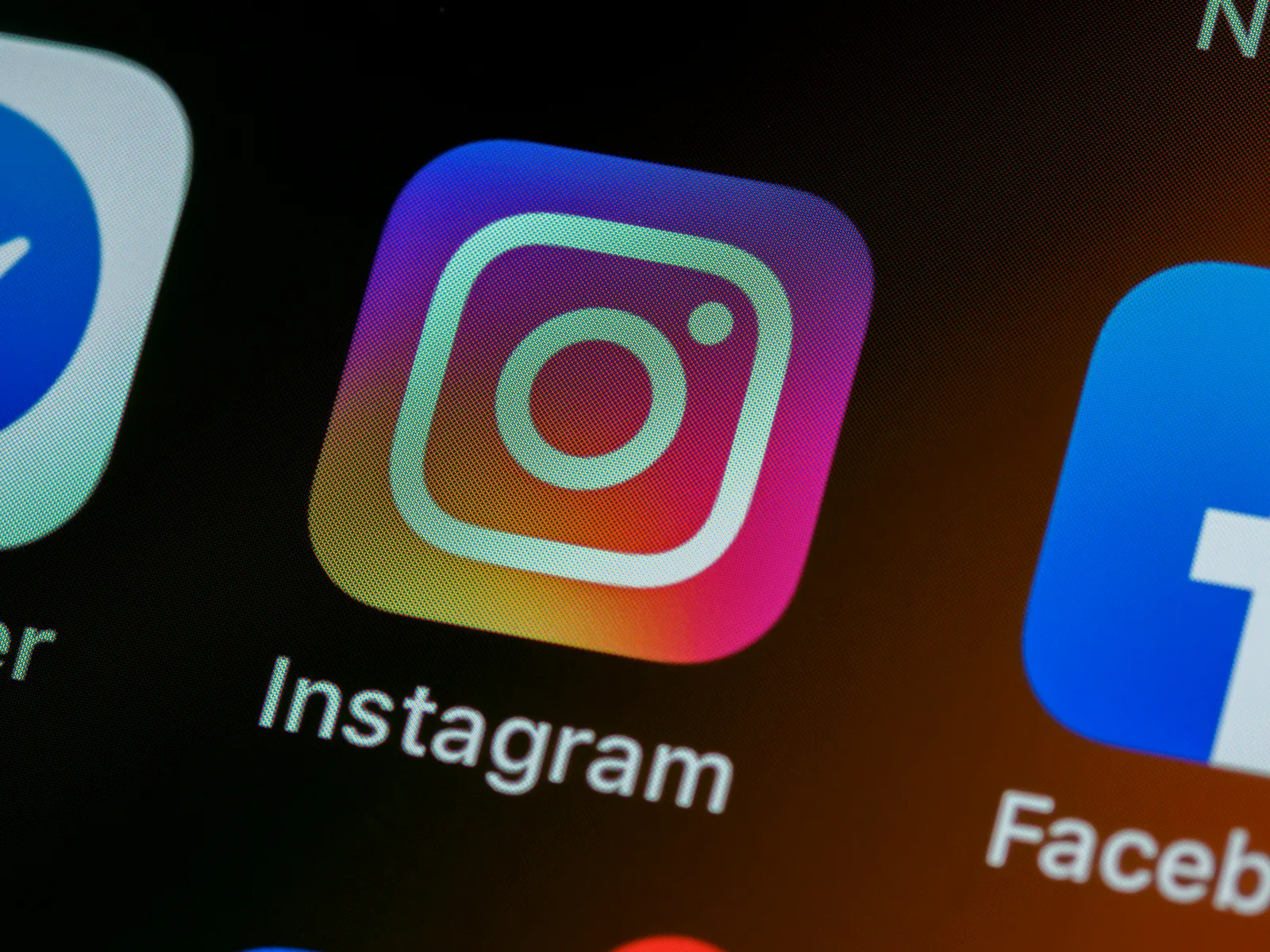 Close-up of Instagram and Facebook app icons on a phone