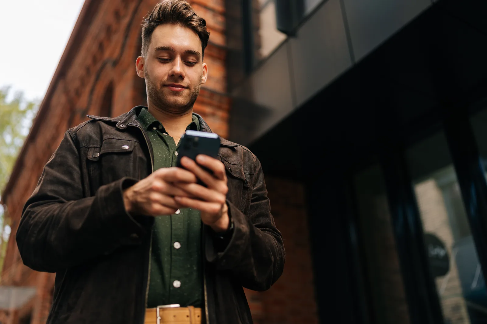 A person using a smartphone outdoors